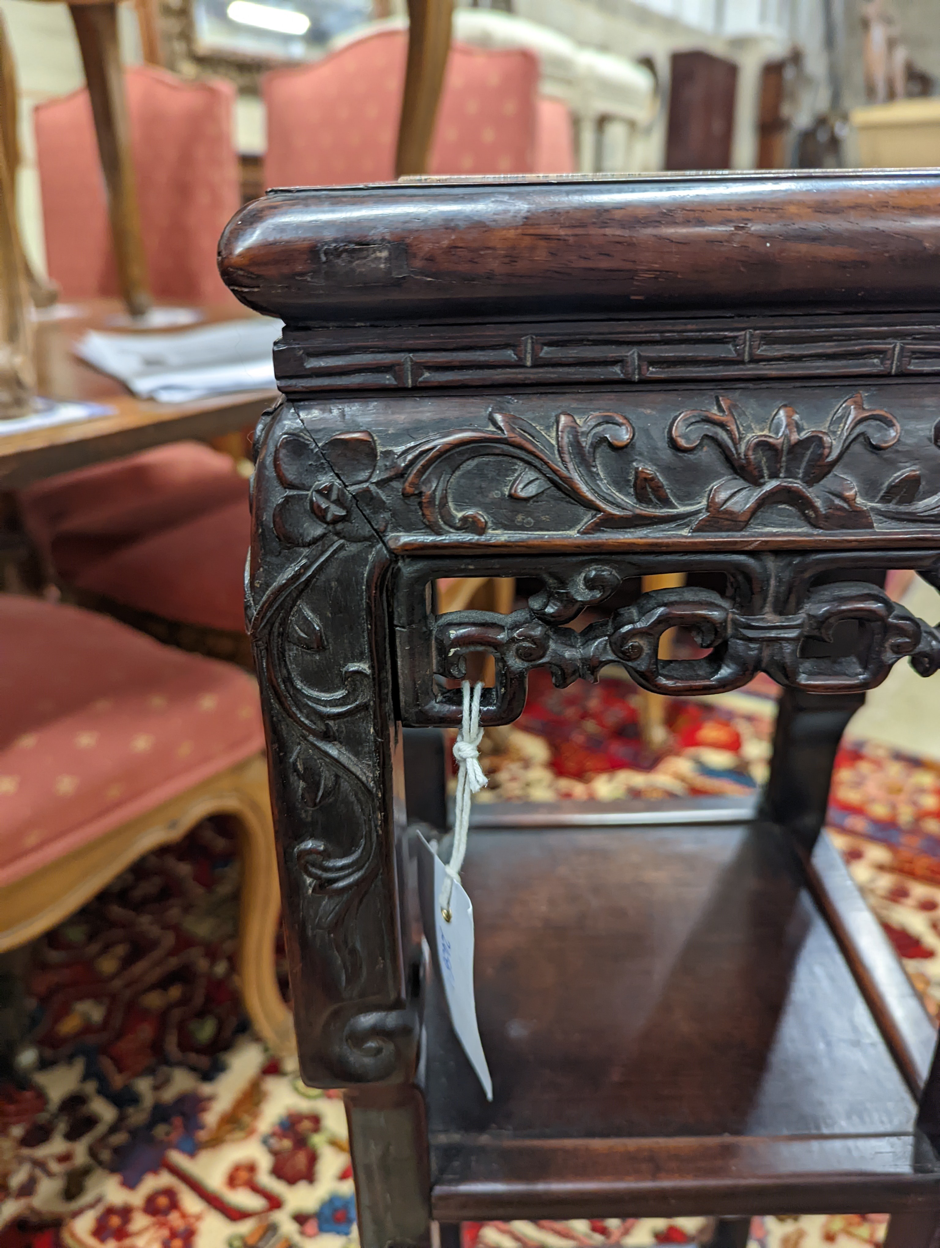 A Chinese carved hardwood three tier jardiniere stand, marble inset, width 22cm, depth 22cm, height 82cm